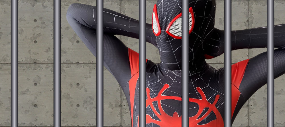 Young man in a superhero costume in prison.